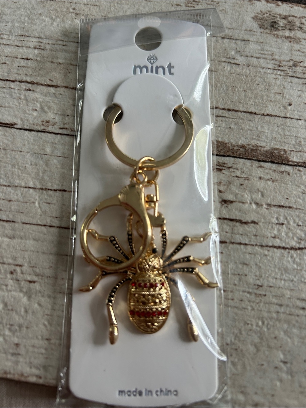 5/$25 Mint Gold Spider Keyring with Red Accents